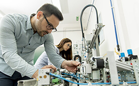 students operating mechatronic equipment