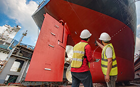 technicians doing maintenance on a boat